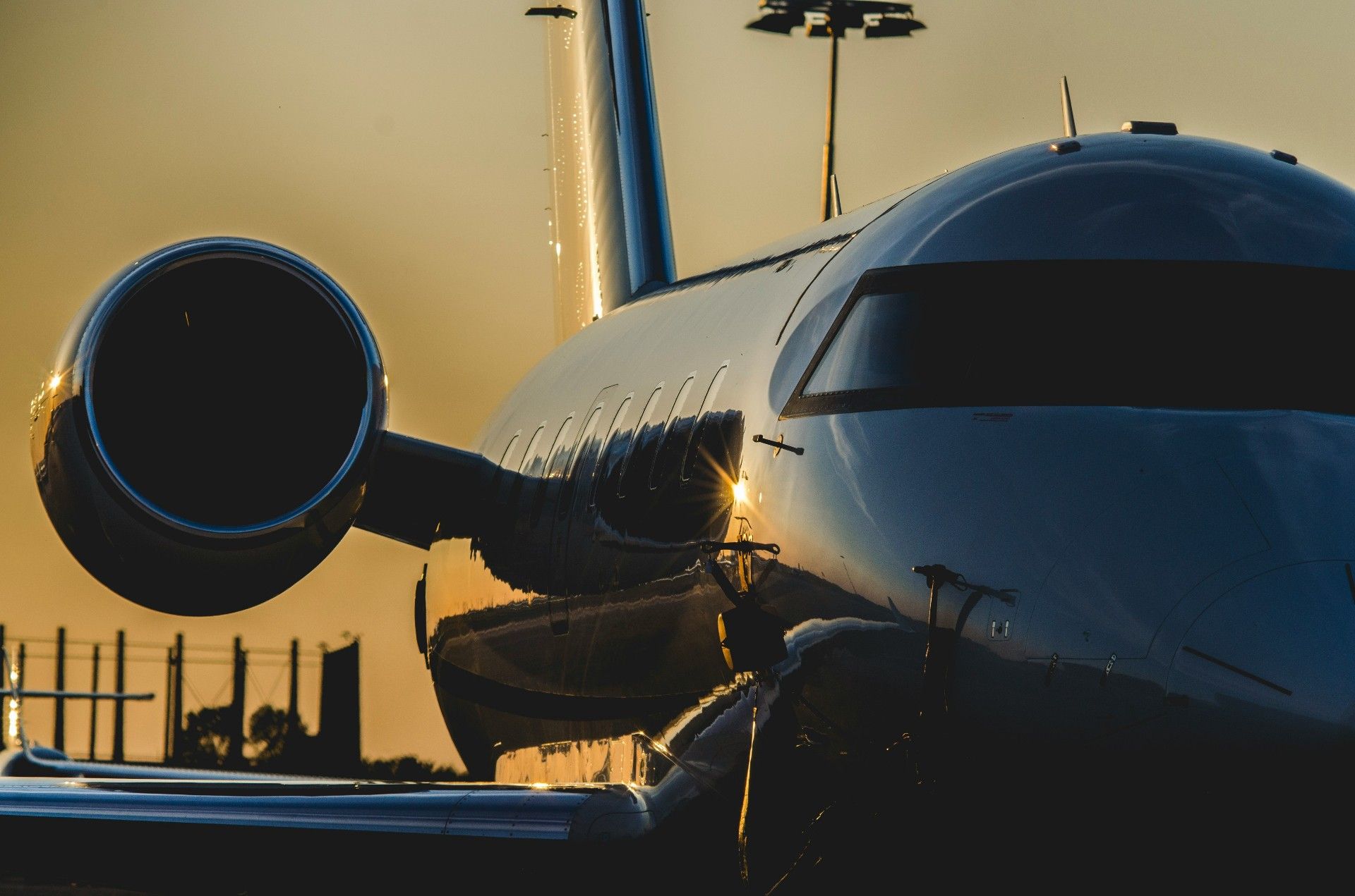 Business aircraft flying above a layer of clouds